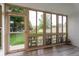 Relaxing sunroom with large windows that overlooks a lush green lawn, offering a serene retreat at 625 S Alton Way # 3A, Denver, CO 80247