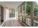 Inviting sunroom filled with natural light, providing a tranquil space to relax and enjoy the outdoor view at 625 S Alton Way # 3A, Denver, CO 80247