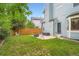Backyard features a well-maintained lawn and a patio area with a fire pit at 5362 S Danube Ct, Centennial, CO 80015