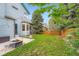 Backyard features a well-maintained lawn and a patio area with a fire pit at 5362 S Danube Ct, Centennial, CO 80015