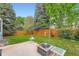 Backyard features a well-maintained lawn and a patio area with a fire pit at 5362 S Danube Ct, Centennial, CO 80015