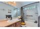Bright bathroom with a shower-tub combination and a wooden vanity at 5362 S Danube Ct, Centennial, CO 80015