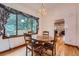 Traditional dining room with hardwood floors, a chandelier, and a large window at 5362 S Danube Ct, Centennial, CO 80015