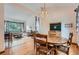 Bright dining area with hardwood floors, chandelier, and open to the living room at 5362 S Danube Ct, Centennial, CO 80015