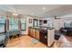 Open kitchen with breakfast bar, wood cabinets, and lots of counter space at 5362 S Danube Ct, Centennial, CO 80015