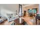 Bright living room with hardwood floors, high ceilings, and large windows at 5362 S Danube Ct, Centennial, CO 80015