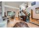Open-concept living space with hardwood floors, high ceilings, and traditional decor at 5362 S Danube Ct, Centennial, CO 80015