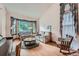Cozy living room with comfortable seating, a bay window, and lots of natural light at 5362 S Danube Ct, Centennial, CO 80015