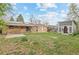 Large backyard features a covered patio, shed, and plenty of space for outdoor activities at 3117 Victor St, Aurora, CO 80011