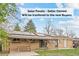 View of the backyard featuring solar panels on the roof and a patio area at 3117 Victor St, Aurora, CO 80011