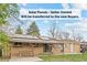 Home with solar panels, covered patio, and picnic area at 3117 Victor St, Aurora, CO 80011