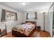 Comfortable bedroom featuring hardwood floors, neutral walls, and natural light at 3117 Victor St, Aurora, CO 80011