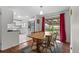 Bright dining area adjacent to kitchen with sliding door to outside and room for a large table at 3117 Victor St, Aurora, CO 80011