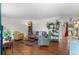 Spacious living room boasting hardwood floors, contemporary furniture, and lots of natural light at 3117 Victor St, Aurora, CO 80011