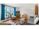 Cozy living room with hardwood floors, ample natural light, and stylish contemporary furnishings at 3117 Victor St, Aurora, CO 80011