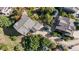 Birds eye view of a home featuring an extra-long driveway, large roof, and a landscaped lawn at 1519 Stonehill Ct, Castle Rock, CO 80104