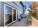 Elevated back deck with sliding glass doors and comfortable patio furniture provides a relaxing outdoor space at 1519 Stonehill Ct, Castle Rock, CO 80104