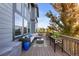 Relaxing back deck boasts comfortable seating, stylish decor, and views of the surroundings at 1519 Stonehill Ct, Castle Rock, CO 80104