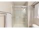 Bathroom features a glass enclosed shower with neutral tiles and chrome hardware at 1519 Stonehill Ct, Castle Rock, CO 80104