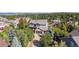 Beautiful two-story home with stone accents nestled within a vibrant community surrounded by lush trees at 1519 Stonehill Ct, Castle Rock, CO 80104