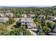 Beautiful two-story home with stone accents nestled within a vibrant community surrounded by lush trees at 1519 Stonehill Ct, Castle Rock, CO 80104