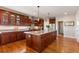 Large kitchen with dark wood cabinets, granite counters, stainless appliances and hardwood floors at 1519 Stonehill Ct, Castle Rock, CO 80104