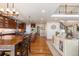 Open kitchen with dark wood cabinets, hardwood floors and a large island at 1519 Stonehill Ct, Castle Rock, CO 80104