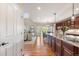 Bright open kitchen with hardwood floors and seamless transition into living room at 1519 Stonehill Ct, Castle Rock, CO 80104