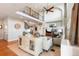 Bright living room with fireplace, hardwood floors, and a view of the upper level at 1519 Stonehill Ct, Castle Rock, CO 80104