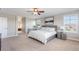 Bright main bedroom featuring a ceiling fan, a serene painting, and ample natural light at 1519 Stonehill Ct, Castle Rock, CO 80104