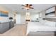 Bright Primary bedroom featuring a gray bed frame, neutral walls, and three windows at 1519 Stonehill Ct, Castle Rock, CO 80104