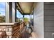 Relaxing covered porch featuring stone accents and a comfortable seating area at 1519 Stonehill Ct, Castle Rock, CO 80104