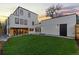Striking modern home with a lush green backyard lawn and a clean white exterior at 1544 S Fillmore St, Denver, CO 80210