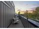 Balcony with railing and outdoor seating offers a place to enjoy an evening sunset at 1544 S Fillmore St, Denver, CO 80210