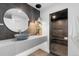 Modern bathroom with vessel sink, unique lighting, and an adjacent glass-enclosed shower at 1544 S Fillmore St, Denver, CO 80210