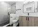 Bright bathroom featuring a glass shower, modern vanity, and sleek fixtures at 1544 S Fillmore St, Denver, CO 80210