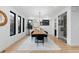 Formal dining room featuring modern lighting, large windows, and an adjacent wine storage room at 1544 S Fillmore St, Denver, CO 80210