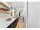Modern kitchen with sleek countertops, and floating shelves at 1544 S Fillmore St, Denver, CO 80210