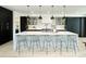 Modern kitchen with a large island, quartz countertops, and stainless steel appliances at 1544 S Fillmore St, Denver, CO 80210