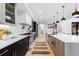 Modern kitchen featuring sleek cabinetry, a large island, and stainless steel appliances at 1544 S Fillmore St, Denver, CO 80210