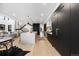 Bright modern kitchen featuring an island with pendant lighting, stainless steel appliances, and light wood flooring at 1544 S Fillmore St, Denver, CO 80210