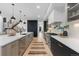Open-concept kitchen featuring sleek countertops and stainless steel appliances at 1544 S Fillmore St, Denver, CO 80210
