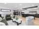 Spacious living area with modern furnishings, hardwood floors, and access to outdoor space at 1544 S Fillmore St, Denver, CO 80210
