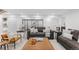 Cozy living room featuring plush seating, stylish decor, and a view of connecting rooms at 1544 S Fillmore St, Denver, CO 80210