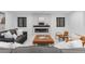 Inviting living room with modern fireplace, comfortable seating, and lots of natural light at 1544 S Fillmore St, Denver, CO 80210