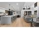 Open concept living room and kitchen with high ceilings and lots of natural light at 1544 S Fillmore St, Denver, CO 80210