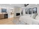 Open-concept main bedroom featuring a fireplace, wet bar, and view into the bathroom at 1544 S Fillmore St, Denver, CO 80210