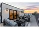 Rooftop deck with seating area and glass doors at 1544 S Fillmore St, Denver, CO 80210
