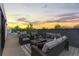 Rooftop deck with comfortable seating and outdoor fireplace with city views at 1544 S Fillmore St, Denver, CO 80210