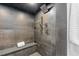 Modern shower featuring a rainfall shower head, handheld sprayer, and a built-in bench at 1544 S Fillmore St, Denver, CO 80210